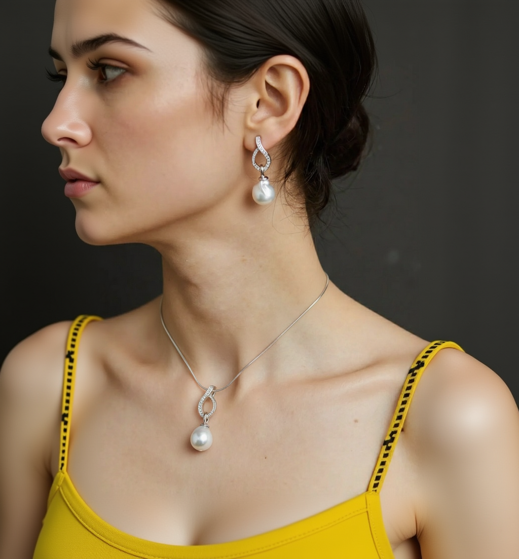 Close-up of a woman wearing pearl earrings and necklace against a dark background