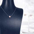 Pearl necklace and earrings on a mannequin and stand